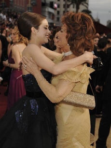 Marion Cotillard and Sophia Loren share a red carpet embrace