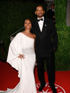 Jada Pinkett Smith and Will Smith pose on the red carpet at the 2009 Vanity Fair Oscar Party