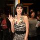 Katy Perry waves from Hard Rock Hotel & Casino in Las Vegas as she unveils a new display with her ‘Hot N Cold’ outfit