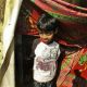 Azharuddin Mohammed Ismail, 10, stands outside his home, a makeshift plastic tent at a slum in Bandra, suburban Mumbai, India, Friday, Feb. 20, 2009. Azharuddin played the youngest version of Salim, the brother of the main character Jamal, in the Oscar-nominated film ‘Slumdog Millionaire.’