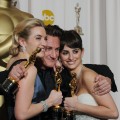 Best Actor winner Sean Penn grabs fellow Oscar winners Kate Winslet (Best Actress) and Penelope Cruz (Best Supporting Actress) backstage at the Oscars