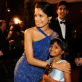 Freida Pinto, Rubiana Ali (holding one of the Academy Award statues that ‘Slumdog Millionaire’ won) and Dev Patel at the 81st Annual Academy Awards Governor’s Ball