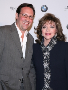 Percy Gibson and Joan Collins arrive to the BMW Art Car Installation Launch Party hosted by Vanity Fair held at the Los Angeles County Museum of Art (LACMA) on February 18, 2009 in Los Angeles, California