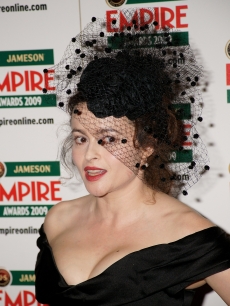 Helena Bonham Carter poses with her best actress award in the press room at The Jameson Empire Magazine Awards