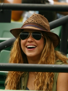 Shakira watches as Rafael Nadal of Spain plays Frederico Gil of Portugal during day 8 of the Sony Ericsson Open, Florida, March 30, 2009