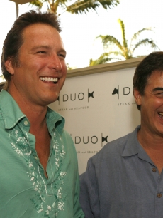 John Corbett and Chris Noth share a laugh at the grand opening of a hotel in Maui, April 28, 2007