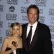 Sarah Jessica Parker, holding her award for Best Actress, Television Series, Musical/Comedy for her role in ‘Sex and the City,’ with John Corbett at the 59th Annual Golden Globe Awards January 20, 2002