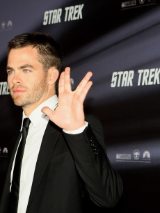 Chris Pine gives a Vulcan sign on the red carpet at the ‘Star Trek’ world premiere in Sydney