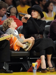 Diane Keaton takes a picture of her son Duke at the Lakers vs. Nuggets game on Thursday, April 9, 2009