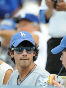 Camilla Belle, Joe Jonas and Nick Jonas at Dodger Stadium for opening day, April 13, 2009