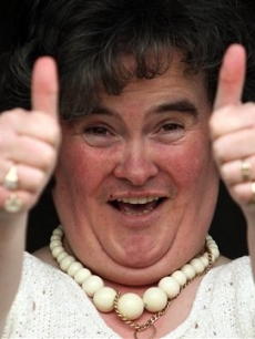 Susan Boyle, who’s performance on the television show “Britain’s Got Talent” wowed the judges, gives the thumbs up at her home in Blackburn, Scotland, Thursday April 16, 2009