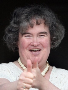 Susan Boyle, who’s performance on the television show “Britain’s Got Talent” wowed the judges, gives the thumbs up at her home in Blackburn, Scotland, Thursday April 16, 2009