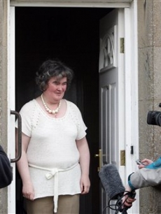 Susan Boyle, who’s performance on the television show “Britain’s Got Talent” wowed the judges, gives the thumbs up at her home in Blackburn, Scotland, Thursday April 16, 2009