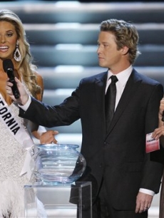 Miss California, Carrie Prejean, fields a question about gay marriage alongside hosts Billy Bush and Nadine Velazquez at the Miss USA pageant
