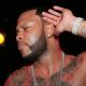 Flo Rida listens up during a performance at the Roxy in LA