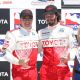 Racing star Al Unser Jr. and Keanu Reeves accept their trophies at the Toyota Grand Prix of Long Beach Pro-Celebrity race