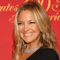 Kate Hudson shows off her gorgeous smile on the way into the Cartier 100th celebration, NYC, April 30, 2009