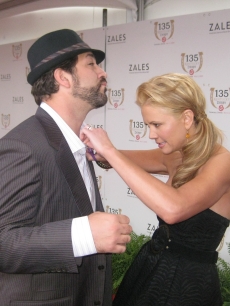 Nancy O’Dell gives Joey Fatone a hand at the Kentucky Derby