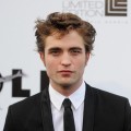 Robert Pattinson arrives at the amfAR Cinema Against AIDS 2009 benefit auction on May 21, 2009 during the 62nd Annual Cannes Film Festival