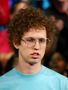 Jon Heder appears on stage during MTV’s Total Request Live at the MTV Times Square Studios June 14, 2004