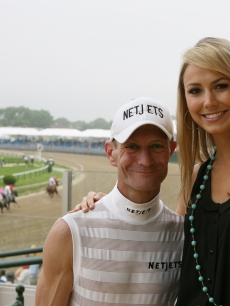 Stacy Keibler smiles with Kentucky Derby-winning jockey Calvin Borel just before his win at the Preakness Stakes