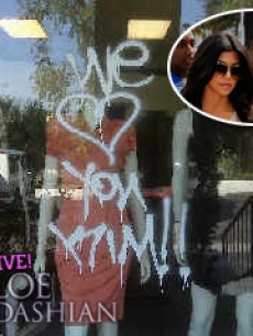 Kourtney and Khloe Kardashian pictured with the vandalism of the sisters’ LA Dash boutique