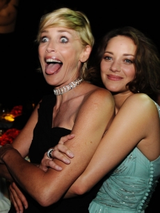 Sharon Stone and Marion Cotillard attend the amfAR Cinema Against AIDS 2009 dinner at the Hotel du Cap during the 62nd Annual Cannes Film Festival on May 21, 2009
