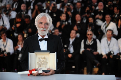 Austrian director Michael Haneke poses after being awarded with the Palme d’Or for his movie ‘Das Weisse Band’ (The White Ribbon), after the Closing Ceremony of the 62nd Cannes Film Festival on May 24, 2009
