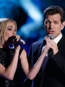 LeAnn Rimes (L) and Chris Isaak perform onstage during the 18th Annual MTV Movie Awards held at the Gibson Amphitheatre on May 31, 2009 in Universal City, California.