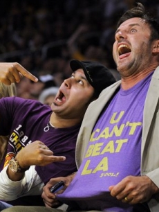 David Arquette and a pal joke around during the second half action at game one of the NBA basketball finals on June 4, 2009, in LA