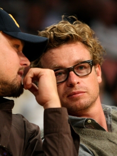 Leonardo DiCaprio and Simon Baker chat courtside during game two of the 2009 NBA Finals on June 7, 2009 in LA