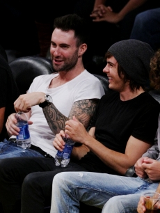 Adam Levine and Zac Efron share a laugh at game two of the NBA Finals on June 7, 2009 in LA