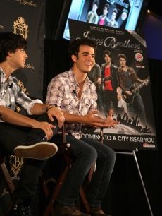 Kevin Jonas talks with the press during a press conference to promote
the Jonas Brothers tour in Arlington, Texas on June 8, 2009