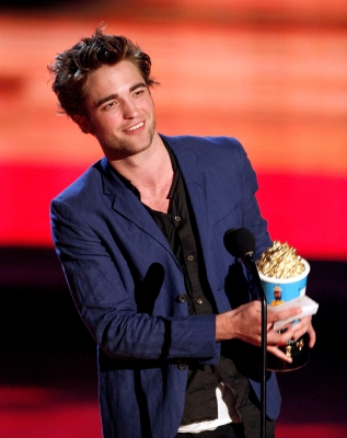 Robert Pattinson accepts the Breakthrough Male Performance awards onstage during the 18th Annual MTV Movie Awards