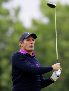 Michael Bolton tees off from the 1st hole during the Shooting Stars in Desert Nights Benefit 2009 Golf Day at The London Golf Club on June 11, 2009 in London, England.