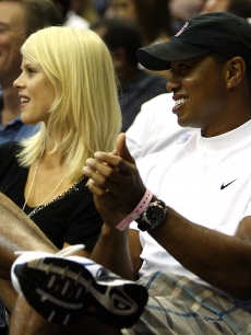 Tiger Woods and wife Elin Nordegren take in the action during game four of the 2009 NBA Finals between the Los Angeles Lakers and the Orlando Magic on June 11, 2009