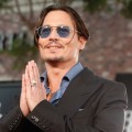Johnny Depp flashes a grin at the premiere of ‘Public Enemies’ in Los Angeles on June 23, 2009