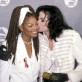 Michael Jackson gives sister Janet Jackson a kiss at the 35th Annual Grammy Awards, Feb. 24, 1993