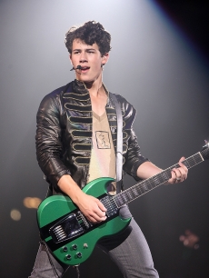 Nick Jonas of Jonas Brothers rocks the Pepsi Center on June 24, 2009 in Denver, Colorado