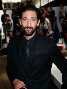 Adrien Brody strikes a pose at the Hugo Boss fashion show in Paris on June 25 2009