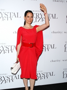Lucy Liu waves on the red carpet at the Swarovski Crystallized Concept store grand opening in New York City on June 25, 2009