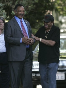 Rev. Jesse Jackson and Joe Jackson share a light moment outside the Jackson family home in the Encino neighborhood of Los Angeles on June 26, 2009