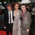 Rupert Grint, Emma Watson and Daniel Radcliffe brave the rain at the world premiere of ‘Harry Potter and the Half Blood Prince’ in London on July 7, 2009 