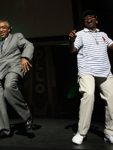 Reverend Al Sharpton and Spike Lee bust a move onstage during a public memorial for Michael Jackson at The Apollo Theater in New York City on June 30, 2009