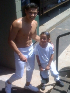 A shirtless Alex Meraz poses with Catherine Grimme, who plays Young Bella in ‘Twilight’