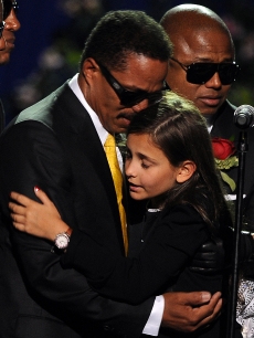 Michael Jackson’s daughter Paris Michael Katherine is comforted by her uncle Marlon Jackson at a memorial service for music legend Michael Jackson (pool photo: AFP)