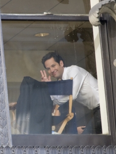 Paul Rudd smiles as he waves from a window in Philadelphia on July 7, 2009 