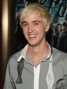 Tom Felton loosens his tie at the ‘Harry Potter and the Half-Blood Prince’ premiere in New York City on July 9, 2009 