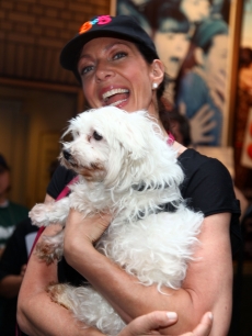 Allison Janney poses with a furry friend at the 11th Annual Broadway Barks event in Shubert Theatre in New York City on July 11, 2009 