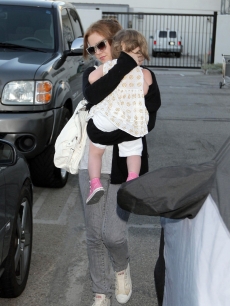 Isla Fisher with daughter Olive Cohen spotted at LAX on July 13, 2009 in Los Angeles
